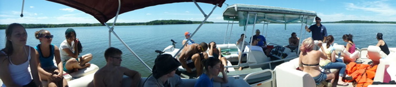 students on a pontoon boat
