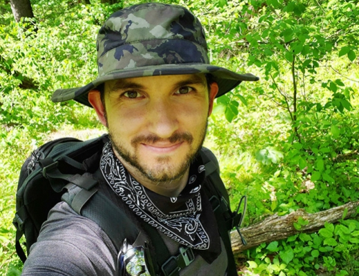 man in forest with bandana