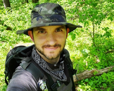 man in forest with bandana