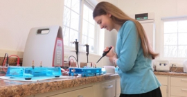 female student pippetting in the laboratory