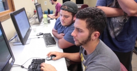 students gazing at computer